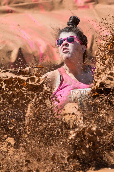 Woman Creates Large Muddy Splash At Dirty Girl Mud Run