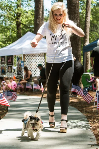 Woman Walks Dog In Canine Fashion Show