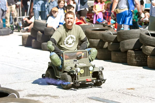 Man Races Miniature Army Jeep At Fair