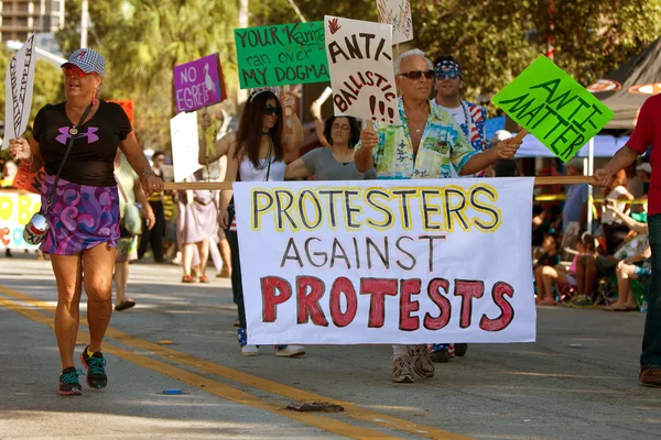 Protesters Against Protests March In Oddball Miami Parade