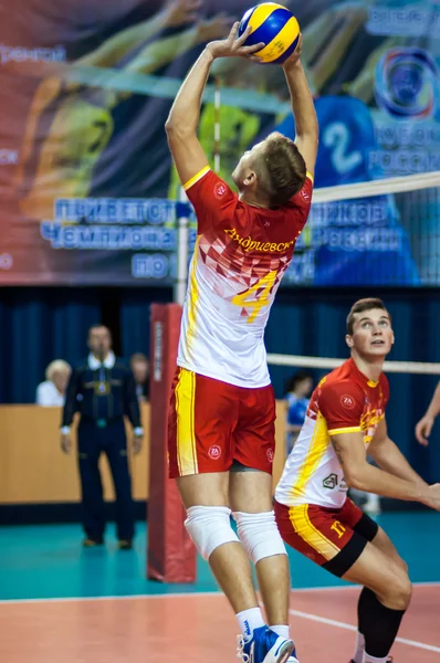 Men play volleyball
