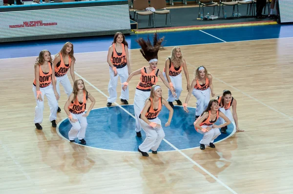 Girls cheerleading appear on basketball parquet