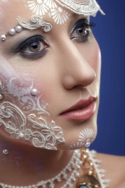 Gorgeous woman with extravagant bridal make up