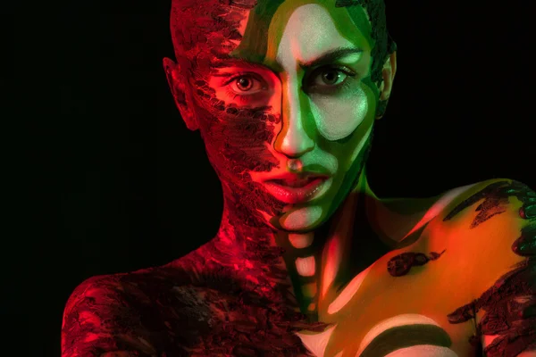Woman with clay on face and body painting