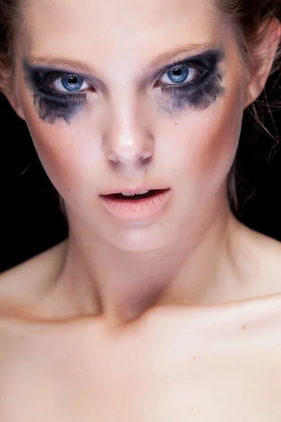 Gorgeous woman with black crying make up