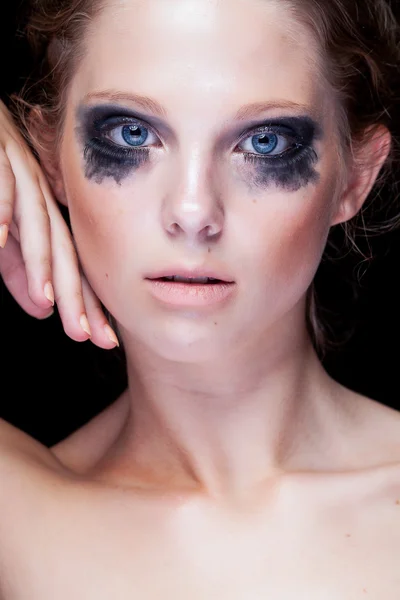 Gorgeous woman with black crying make up