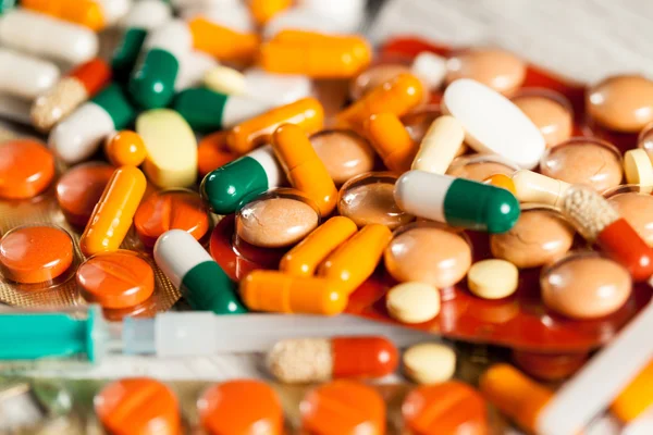 Medicine prescription. Pills and antibiotic in blurred backgroun