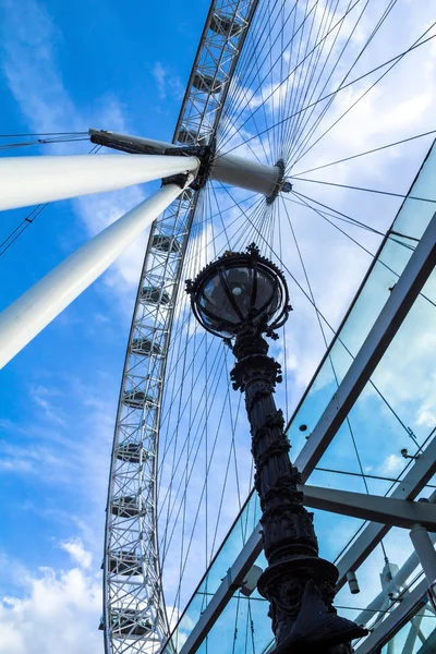 Moving London Eye on blue sky background