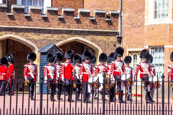 British guardsmen preparing for the parade opposite St. James Palace. The Mall. London. UK