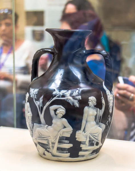 British Museum. Visitors look at the Roman Portland Vase or  cameo glass vase, dated to between AD 15 and AD 25