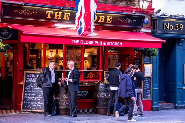 Unidentified people near small pub at Covent Garden neighborhood, London.