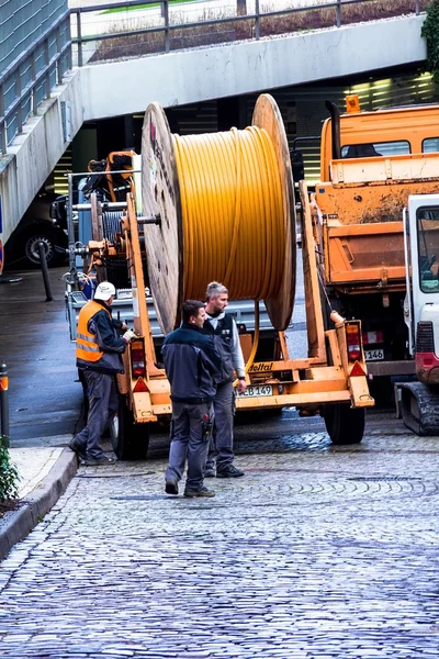 Construction workers make repair urban engineering. Replacement of cable laying modern optical communication