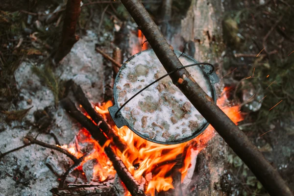 Fish soup to cook on fire in nature.