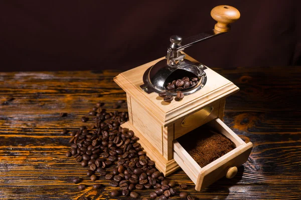 Grinding Roasted Coffee Beans with Hand Grinder