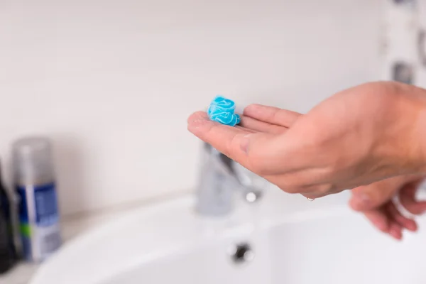 Shaving gel on man\'s hand