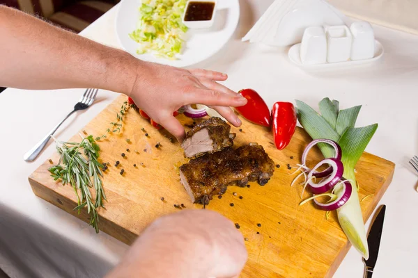 Slicing Appetizing Cooked Meat on Wooden Table