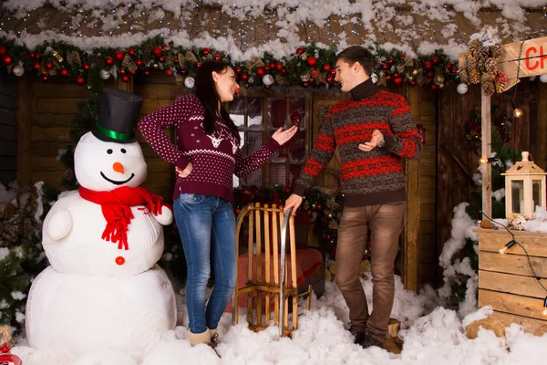 Talking Couple Surrounded with Christmas Decors
