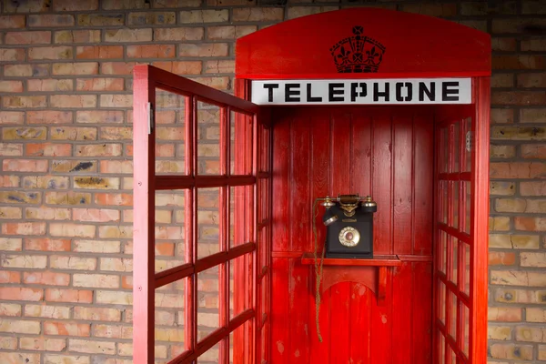 Old Fashioned Red Telephone Booth with Open Door