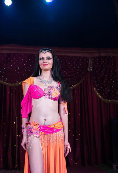 Exotic Belly Dancer Standing on Stage Smiling