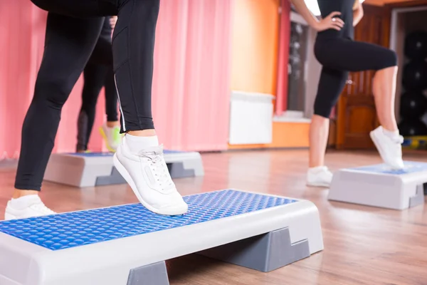 Close Up of Woman Wearing Sneakers in Step Class