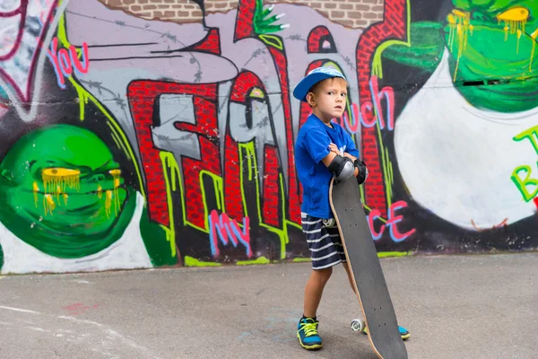 Boy with Attitude Standing with Skateboard