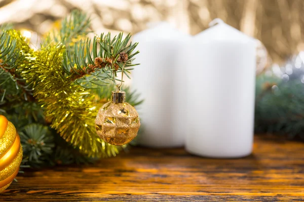 Festive Pine Branches on Table with White Candles