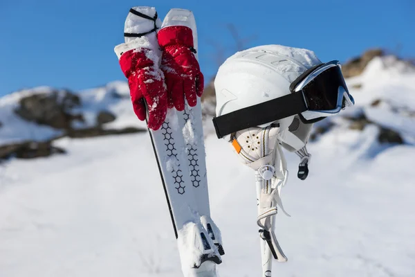 Gloves, poles and headgear for skiing theme