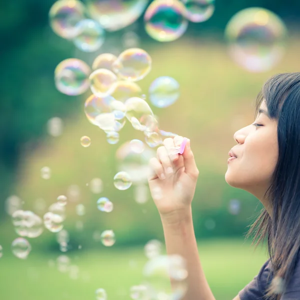 Blowing a soap bubbles