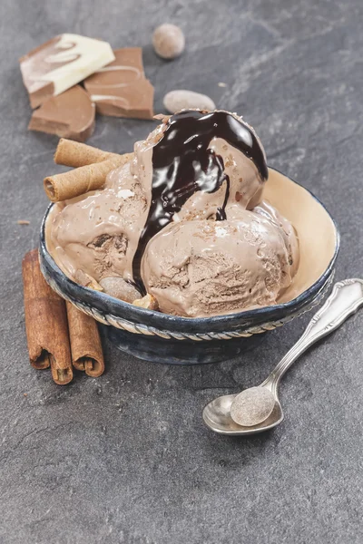 Ice cream with nuts and chocolate topping