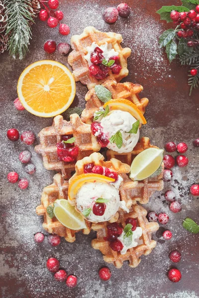 Waffles with ice cream and oranges