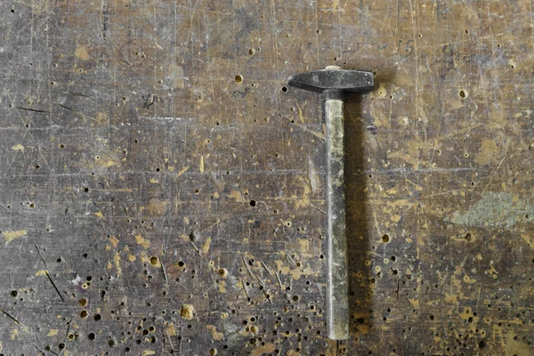 Old carpenters hammer on vintage wooden background