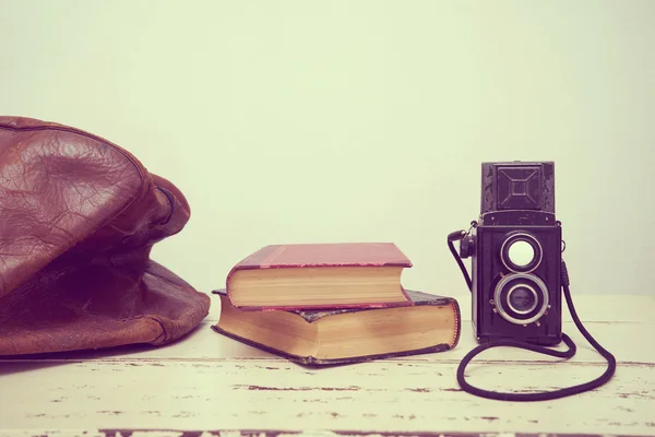 Vintage suitcases with books and camera