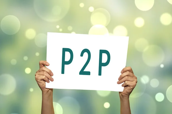 P2P (peer to peer) card in hand with abstract light background.