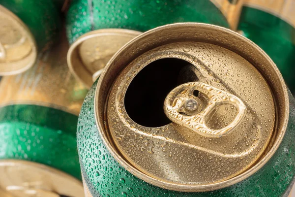 Close up can of beer with drops .