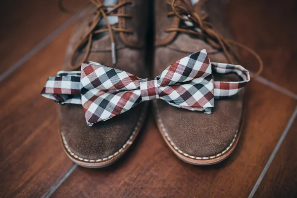 Bow tie on brown shoes