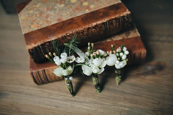 Books and flowers buttonholes