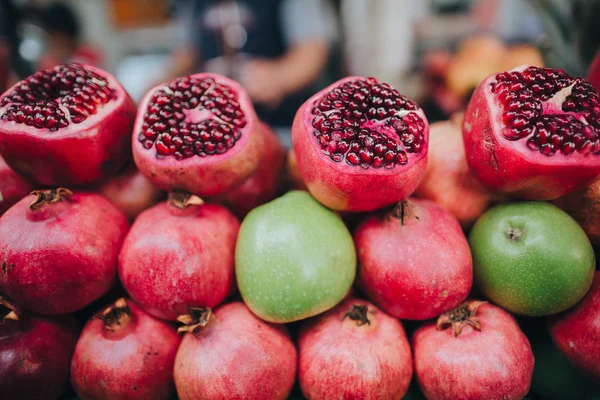 Sliced pomegranates on street market