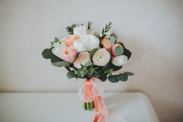 Wedding bouquet of flowers and greenery