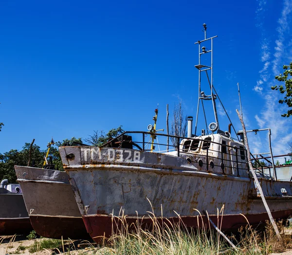 Deserted rusty ship on the coast