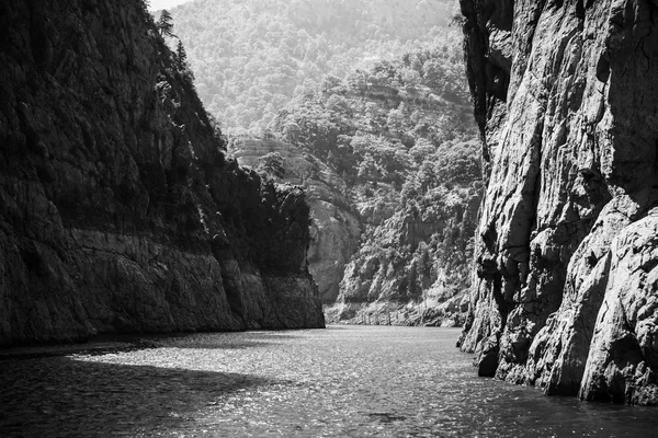 Rocks of Green Canyon lake in Turkey, black and white photo