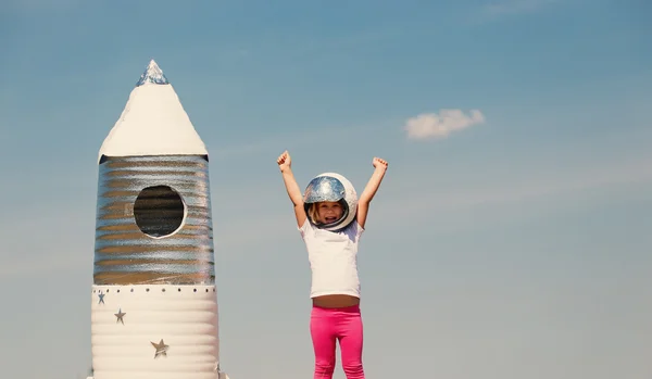 Happy child dressed in an astronaut costume