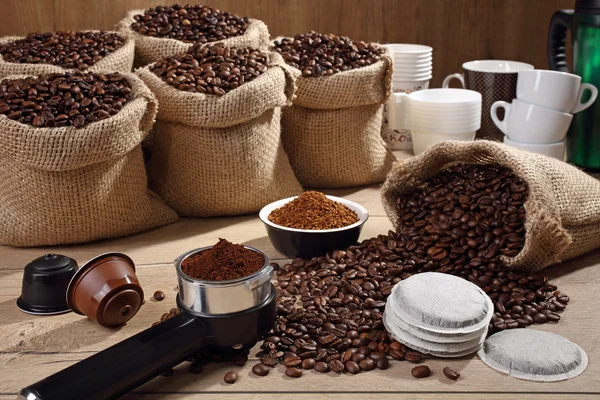 Assortment coffee beans and powder background