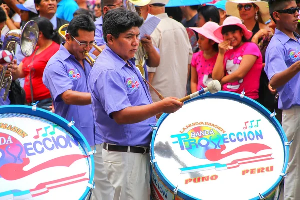 LIMA, PERU-FEBRUARY 1: Unidentified men play drums during Festival of the Virgin de la Candelaria on February 1,2015 in Lima, Peru. Core of the festival is dancing performed by different dance schools