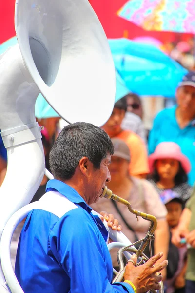 LIMA, PERU-JANUARY 31: Unidentified man plays sausaphone during Festival of the Virgin de la Candelaria on January 31,2015 in Lima, Peru. Core of the festival is dancing performed by different dance schools