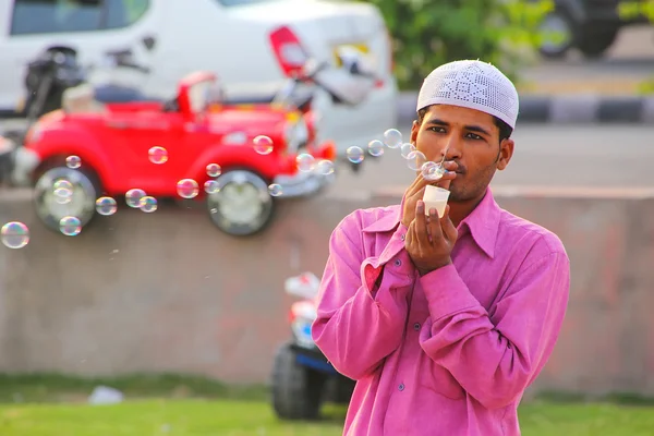 JAIPUR, INDIA - NOVEMBER 13: Unidentified man makes soap bubbles