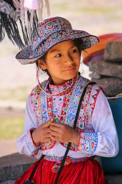 MACA, PERU-JANUARY 16: Unidentified girl in traditional dress si
