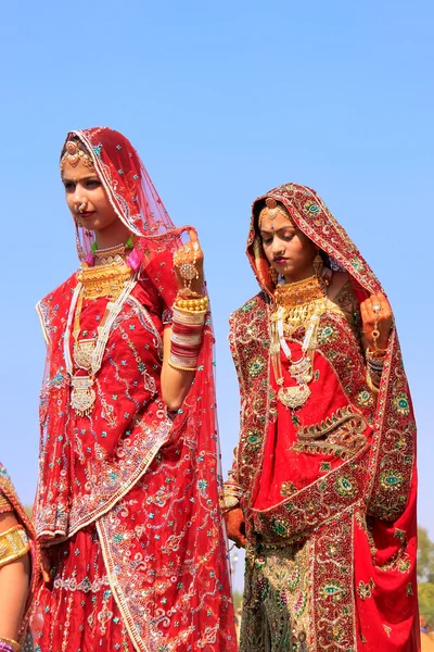 Young women in traditional dress taking part in Desert Festival,