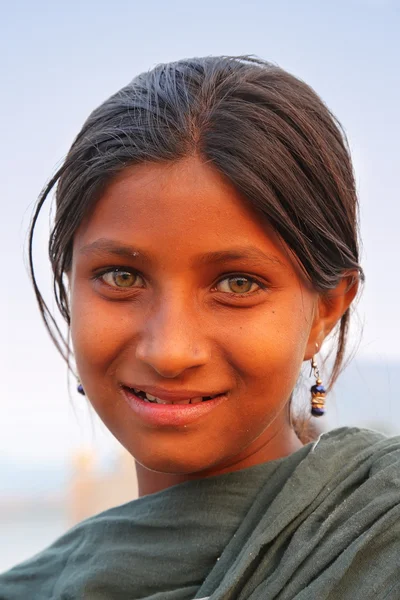 JAIPUR, INDIA - NOVEMBER 13: Unidentified girl (portrait) stands by Man Sagar Lake on November 13, 2014 in Jaipur, India. Jaipur is the capital and largest city of Rajasthan