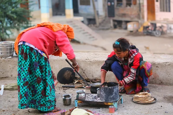 JAIPUR, INDIA - NOVEMBER 14: Unidentified women cook in the street on November 14, 2014 in Jaipur, India. Jaipur is the capital and largest city of the Indian state of Rajasthan.