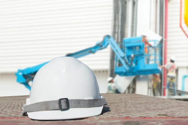 Engineering and safety helmet resting on the profile of the industry.